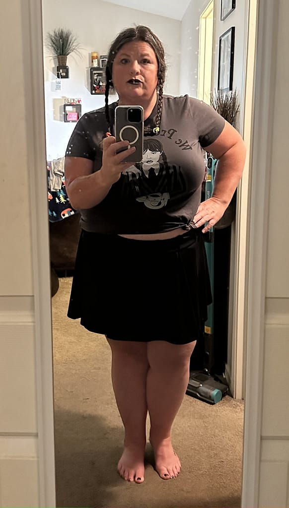 Halloween costume Wednesday Addams - plus size Tish Lee modeling it